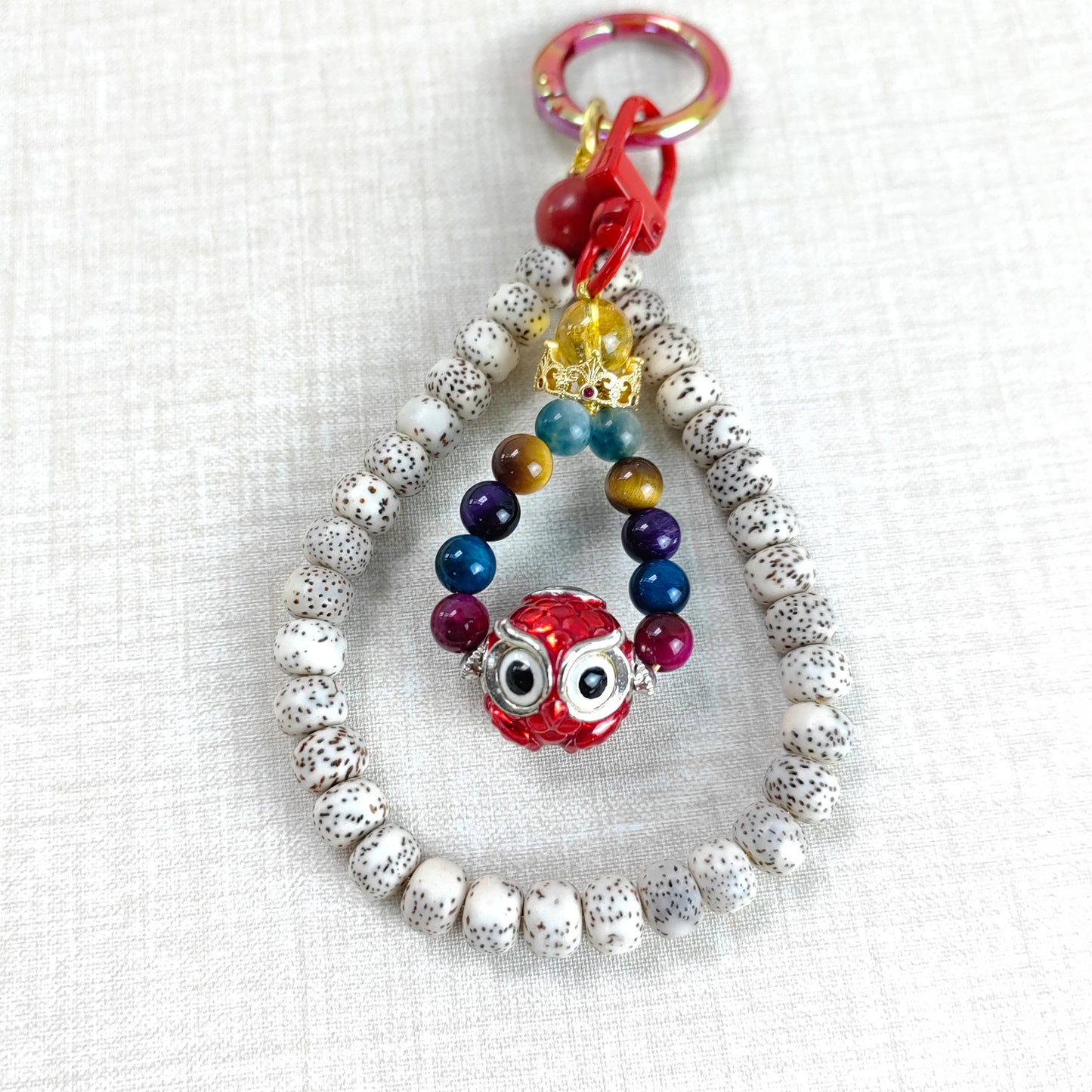 pulsera energética con búho y semilla de bodhi: amuleto para la felicidad y la libertad espiritual